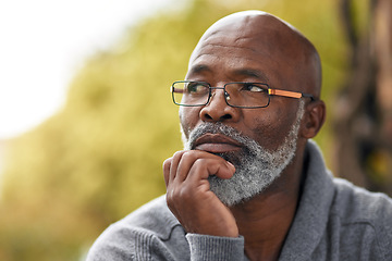 Image showing Senior man, face and thinking outdoor in nature to remember memory, idea or vision. Headshot of an elderly African male person think or planning future, life insurance or retirement at a park