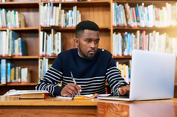 Image showing University. library and student on laptop with research, planning or learning for exam, report or focus on studying, goals and education. Black man, college and working on task, essay or scholarship