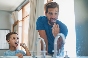 Image showing Happy, brushing teeth and father with son in mirror of bathroom for morning routine, bonding and dental. Oral hygiene, cleaning and smile with man and child in family home for self care and wellness