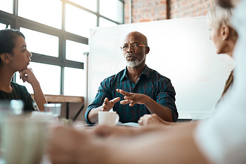 Image showing Meeting, business people and leadership of black man in office, talking or speaking. Teamwork, ceo and senior African male professional brainstorming, collaboration or planning group strategy at work