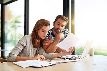 Image showing Finance, documents and couple planning budget for tax, bills and savings on laptop with banking, online payment and investment. People, paperwork and conversation on household financial strategy