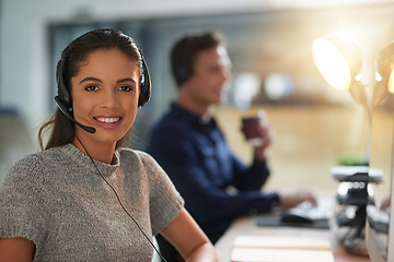 Image showing Call center, happy and portrait of woman at computer for customer service, help desk and consulting. Smile, night and ecommerce with employee in office for contact us, telemarketing and receptionist