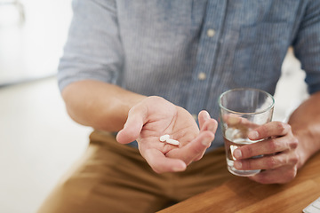 Image showing Medicine, pills and water with hands of man for medical, vitamins and supplements. Healthcare, prescription and pharmacy with closeup of male patient at home for drugs, allergy and mental health