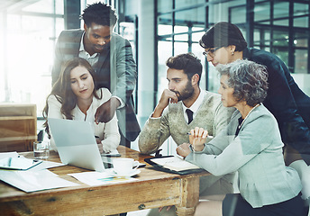 Image showing Business people, team and office with laptop, brainstorming and thinking for solution ideas or meeting. Diversity group, computer and focus with collabroation proposal, project and workplace teamwork