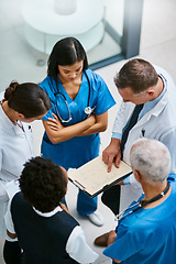 Image showing Teamwork, clipboard and medical with doctors in hospital for consulting, planning and communication. Medicine, healthcare and checklist with group of people for support, review and analysis