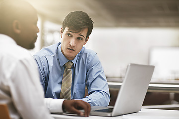 Image showing Laptop, serious conversation and business men in the boardroom for meeting to discuss the company vision. Collaboration, computer and review with an employee team sitting together in the office