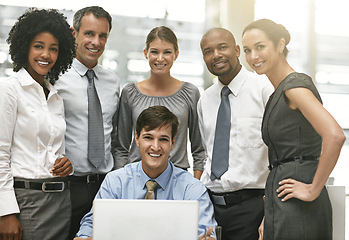 Image showing Portrait, laptop and a group of business people working together in collaboration on a project in their office. Teamwork, computer and corporate with an employee meeting in the boardroom for planning