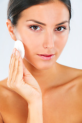 Image showing Skincare, portrait and female model with a cotton pad in studio for a beauty, natural and face routine. Health, wellness and woman with health, wellness or cosmetic facial product by white background