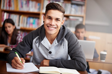 Image showing Learning, writing and college with portrait of man in library for education, research and classroom quiz. Focus, study and notebook with student at university for knowledge, scholarship and project