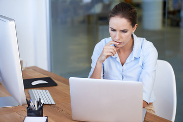 Image showing Confused, business woman and thinking at laptop for decision, choice of solution and problem solving. Serious female worker at computer for planning, doubt of ideas and questions for online analysis