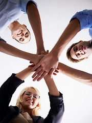 Image showing Portrait, low angle and happy people with hand huddle in support, faq and target of success, business goals or trust. Motivation, hands and group collaboration of teamwork, synergy and victory circle