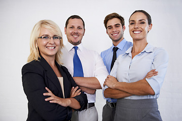 Image showing Portrait, happy people and team with arms crossed in white background, isolated studio and professional collaboration. Group of business employees smile for corporate teamwork, pride and confidence