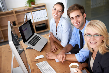 Image showing Portrait, teamwork and happy business people working at desk, computer and planning for collaboration in office. Employees, desktop and smile in company for professional management, project and pride