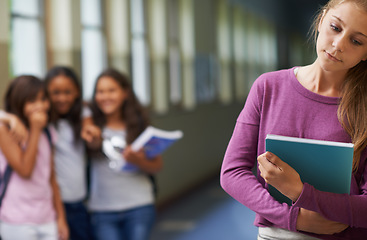 Image showing Girl, depression and bullying with book has anxiety from problem with students at school with autism. Young, teenager and notebook sad at gossip by kids studying for an education with mental health.