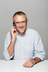 Image showing Senior businessman, phone call and studio portrait with happiness, smile and listen by gray background. Elderly man, happy and excited face for contact, chat and smartphone for networking by backdrop