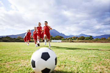 Image showing Running, fitness and sports with children and soccer ball on field for training, competition and teamwork mockup. Game, summer and action with football player on pitch for goals, energy and kids