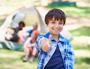 Image showing Happy child, portrait smile and thumbs up for camping success, winning or victory in nature. Little boy or kid smiling and showing thumb emoji, yes sign or like for camp setup, victory or approval