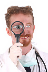 Image showing smiling doctor with loupe