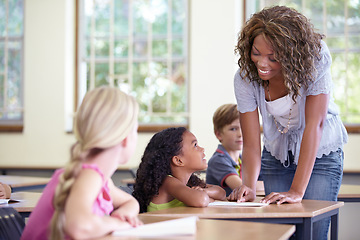 Image showing Learning, classroom and woman with children for education, support and language helping or check test for development. Class assessment, knowledge and teacher or african person teaching kids at desk