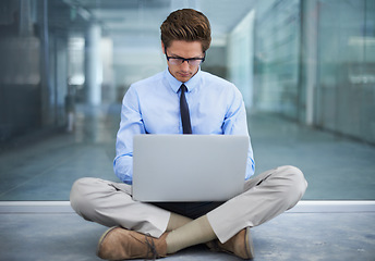 Image showing Laptop, sitting on floor and business man or entrepreneur developer typing code data at remote work. Information technology, research and professional person working on computer for virtual project