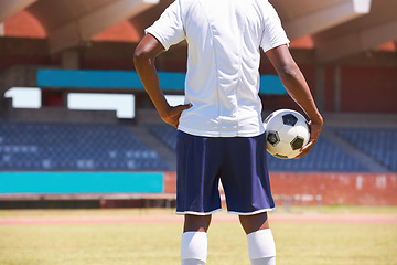 Image showing Man, holding soccer ball and back in stadium for game, competition or outdoor for sports career. Football player, ready and motivation for sport, workout and exercise for health, wellness and contest