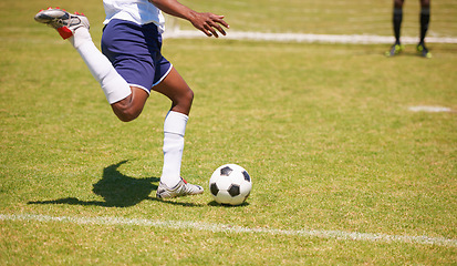 Image showing Feet, soccer player and penalty kick on field for goal, competition or game for sports career. Man, football and shooting ball on grass pitch with accuracy for training, workout and contest outdoor