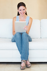 Image showing Portrait, happy woman and relax with digital tablet on a sofa while browsing social media in her home. Face, streaming and female smile in living room online for subscription service or entertainment