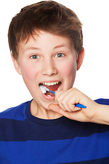 Image showing Face, smile and child brushing teeth in studio isolated on a white background. Portrait, boy and kid with toothbrush for oral health, hygiene and dental wellness, fresh breath and cleaning gums.