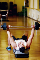 Image showing Barbell exercise, floor or man doing muscle workout, gym studio fitness or training for bodybuilding, muscle growth, challenge. Power strength, bodybuilder or person lying on ground for weightlifting