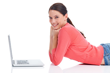 Image showing Laptop, studio portrait and woman on floor doing internet, website or digital web search for research project. Online shopping sales, ecommerce girl and happy model smile isolated on white background