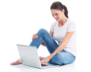 Image showing Laptop, studio ground and happy woman typing internet, website or digital web search for e commerce research project. Online shopping, relax and model reading sales promo isolated on white background