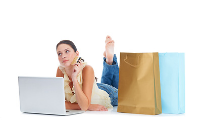 Image showing Online shopping laptop, credit card and woman thinking on floor about fintech payment, sales or retail website. Ecommerce store, gift bag and customer person isolated on white studio background