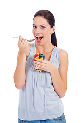 Image showing Portrait, eating woman and fruit salad glass for weight loss, health diet or body detox for wellness lifestyle. Vegan healthcare, nutritionist food or studio model girl isolated on white background