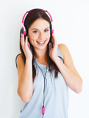 Image showing Music headphones, portrait and happy woman listening to fun girl song, wellness audio podcast or radio sound. Studio smile, freedom and gen z model streaming edm playlist isolated on white background