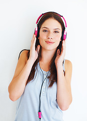 Image showing Music headphones, portrait and happy woman listen to fun girl song, wellness audio podcast or radio sound. Studio smile, freedom and gen z model streaming edm playlist isolated on white background