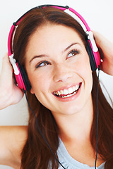 Image showing Music headphones, face and happy woman listening to fun girl song, wellness audio podcast or radio sound. Studio smile, freedom and gen z model streaming edm playlist isolated on white background