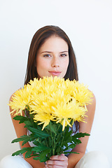 Image showing Flower bouquet, face portrait and studio woman with floral product, sustainable gift or yellow spring present. Nature growth, organic beauty and eco friendly model girl isolated on white background