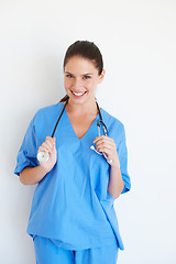 Image showing Medical portrait, stethoscope and nurse happy for nursing career, studio healthcare or cardiology health. Medicine doctor, caregiver woman or hospital surgeon with smile isolated on white background