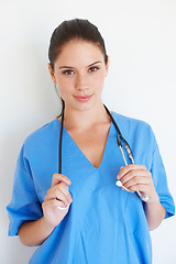 Image showing Studio portrait, stethoscope and nurse smile for nursing career, wellness service or cardiology healthcare support. Medicine doctor, caregiver woman or hospital surgeon isolated on white background