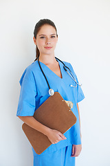 Image showing Studio portrait, smile and nurse with clipboard checklist for nursing, medical healthcare or cardiology health. Medicine doctor, caregiver woman or happy hospital surgeon isolated on white background