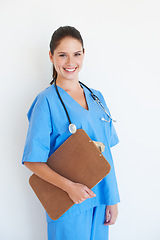 Image showing Studio portrait, happy and nurse with clipboard checklist for nursing healthcare, medical hospital or cardiology health. Medicine doctor, caregiver woman or happy surgeon isolated on white background