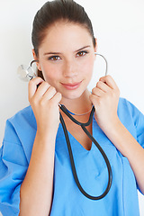 Image showing Studio portrait, listening and nurse with stethoscope for nursing career, medical healthcare or cardiology health. Medicine doctor, caregiver woman or hospital surgeon isolated on white background