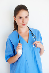 Image showing Health portrait, stethoscope and studio caregiver ready for nursing career, medical healthcare or cardiology. Medicine doctor, nurse woman or hospital nurse with smile isolated on white background