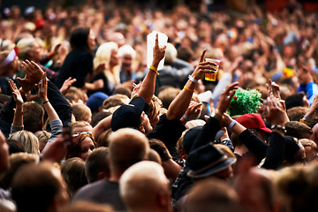 Image showing Dance, music festival and party with crowd at concert and cheering for dj show and rave performance. Rock, energy and hands of people dancing in audience for celebration, disco and techno event