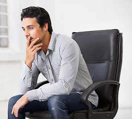 Image showing Thinking, business and man on chair in office with idea for career, job or work management. Professional, male entrepreneur and decision or doubt and manager, ceo or person sitting in workplace.