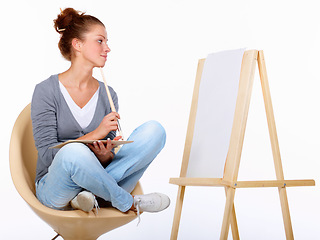 Image showing Woman thinking, painting and art canvas in studio for creativity and talent with paint brush for color. Female artist or painter isolated on a white background for creative work and mockup ideas