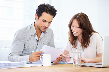 Image showing Documents, planning and business people or partner in meeting collaboration, teamwork or financial review. Startup man and woman with paperwork talking, feedback or advice on finance, taxes or profit