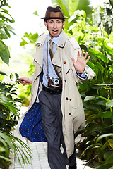 Image showing Detective man, shocked search and portrait in jungle with vintage gear for investigation and solution. Outdoor, private investigator and spy with comedy for surveillance and retro reporter character