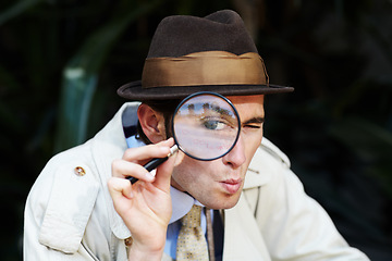 Image showing Private investigator, eye in magnifying glass and portrait of man for detective, searching and looking. Spy, investigation and male person with magnifier for secrets, information and mystery clue