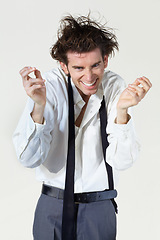 Image showing Crazy, insane and portrait of business man on white background with stress, frustrated and mania. Mental health, depression and face of male worker with burnout, stressed out and messy hair in studio